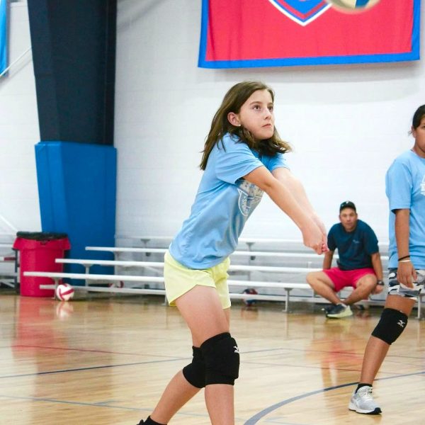 Prep and Developmental Volleyball 16 Girls volleyball camp taking place at Yankee Stadium, featuring young athletes practicing on the court